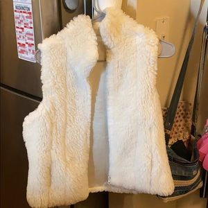 White fuzzy vest